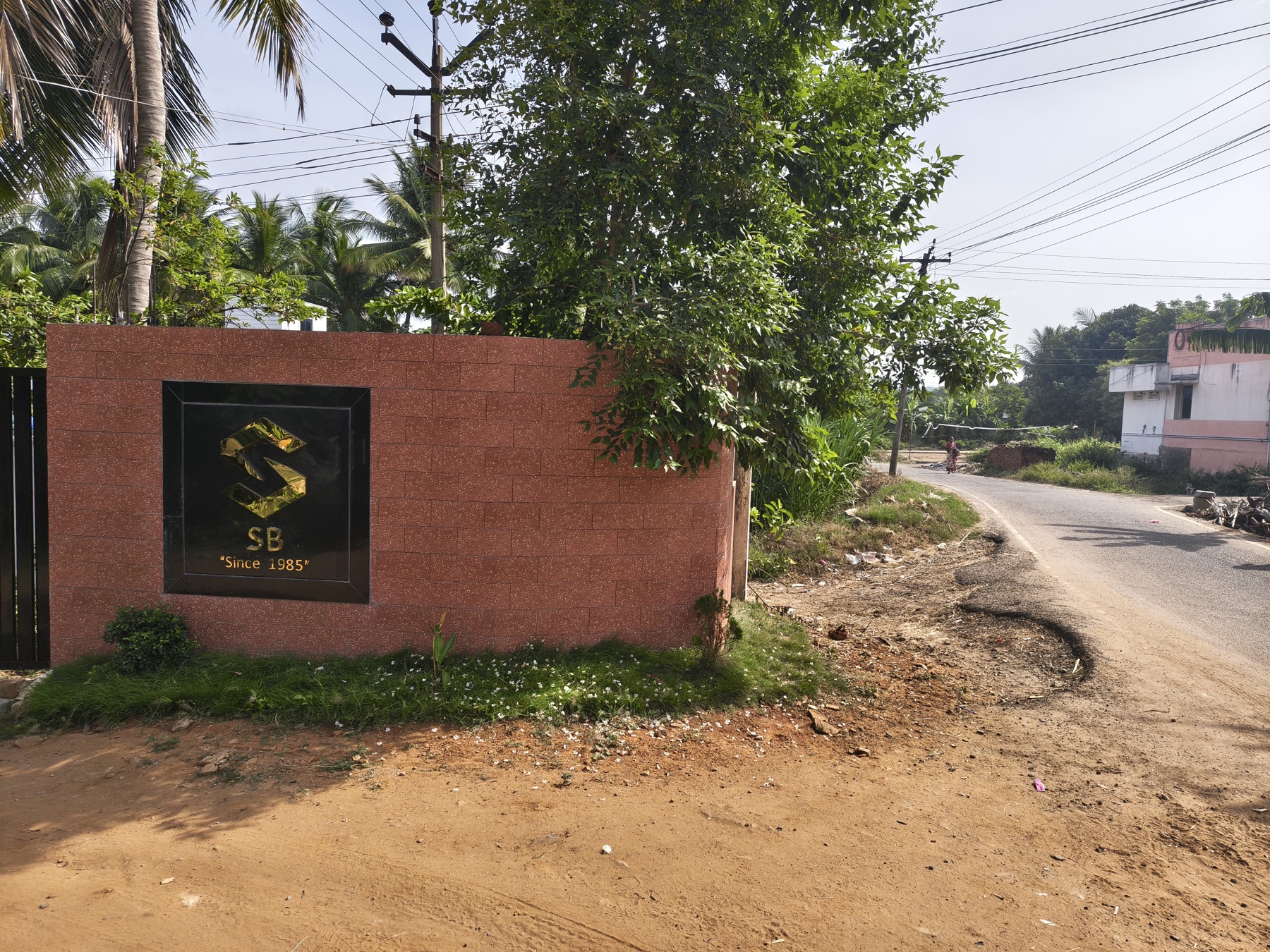 SB monogram wall at the factory entrance